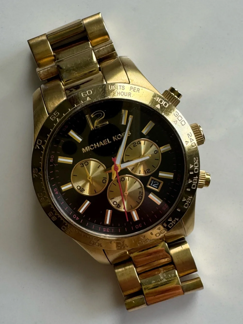 Michael Kors Gold and Black Chronograph Watch with Red Accent